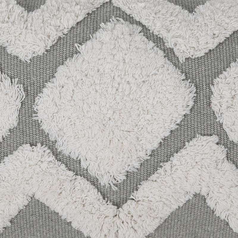Structured living room carpet with 3D tufting and geometric diamond relief