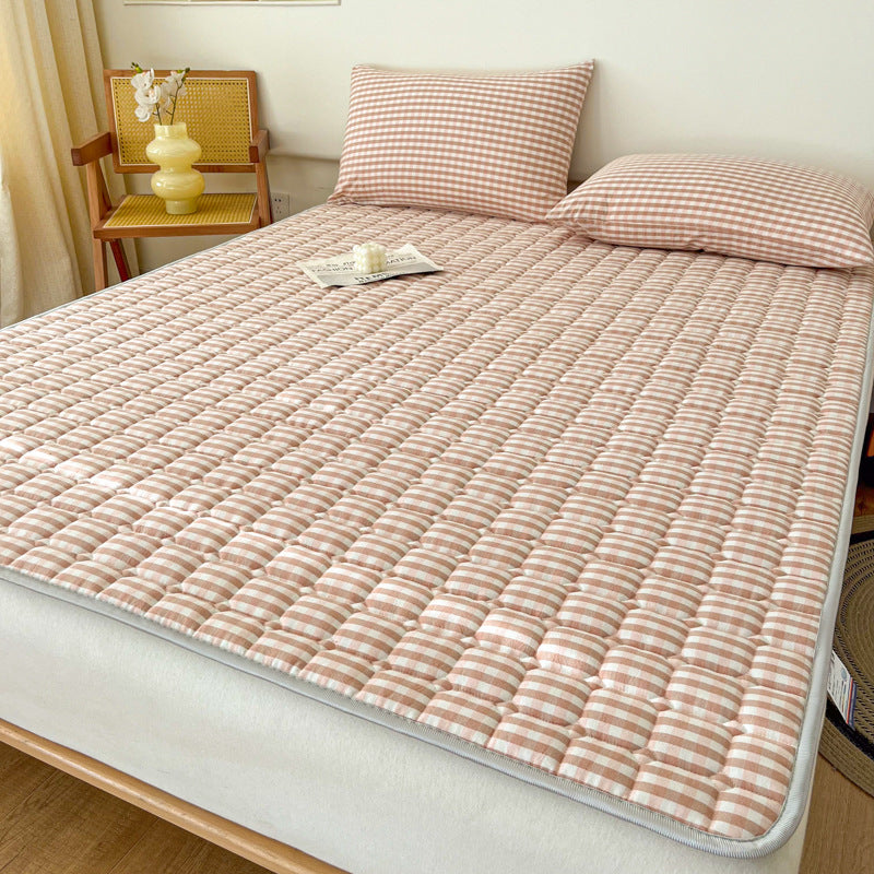 Padded mattress protector-topper with quilting and non-slip underside
