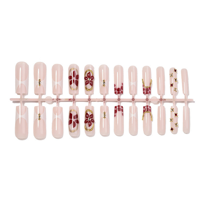 Artificial nail set with floral decorations and elegant accents Stornfield