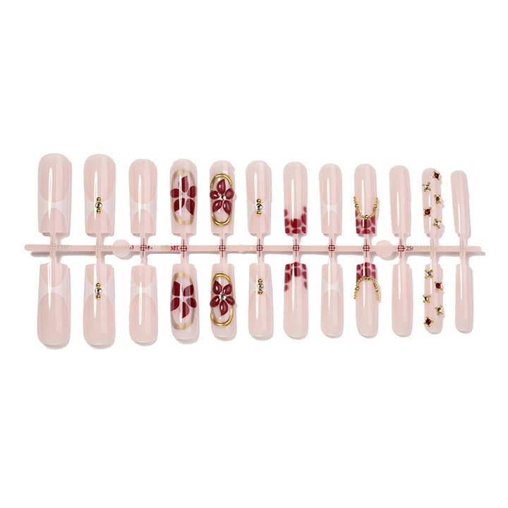 Artificial nail set with floral decorations and elegant accents Stornfield