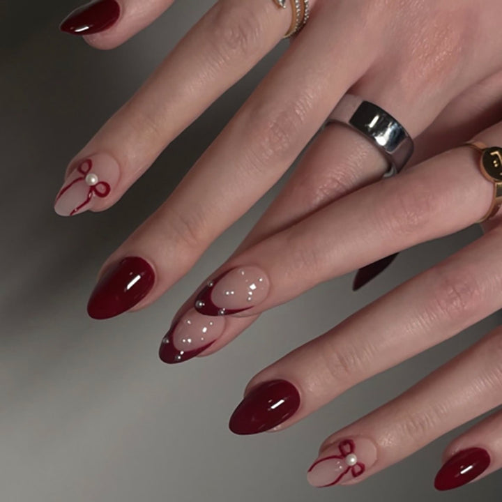 Artificial nail art with playful dots and bows Stornfield
