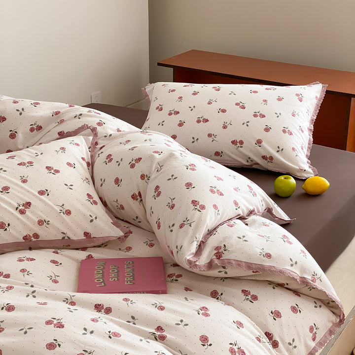 Finely woven cotton percale bedding set with delicate floral print and crocheted lace edge