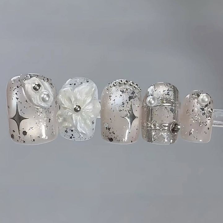 Artistic Press-On Nail Set with Floral and Metallic Accents