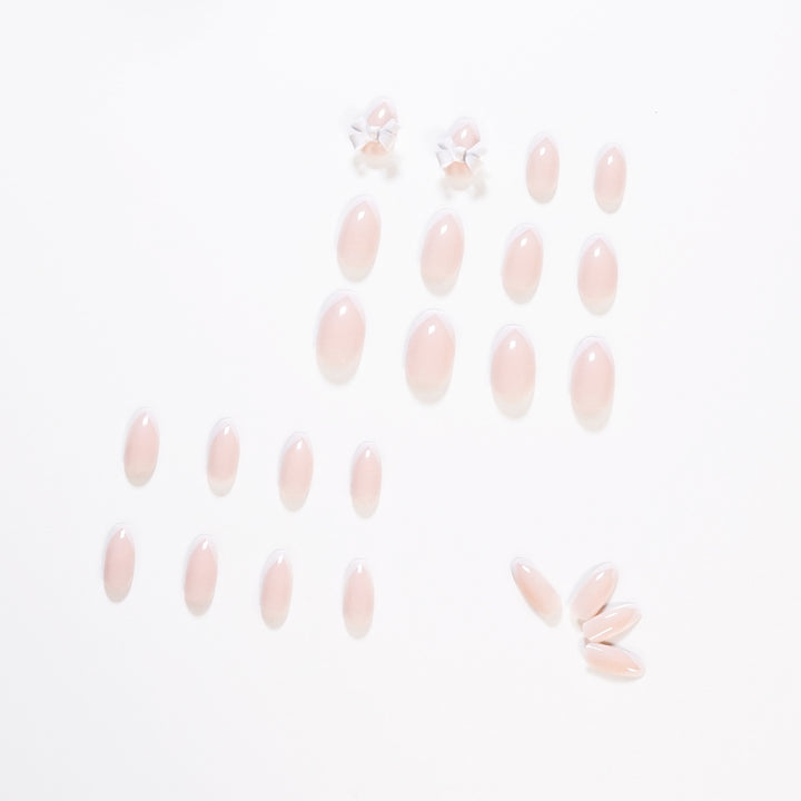 Elegant artificial nails with translucent French tip and decorative floral accents Stornfield