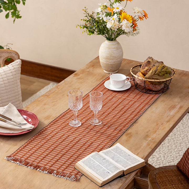 Handwoven plaid made of cotton with structured stripes and fringes