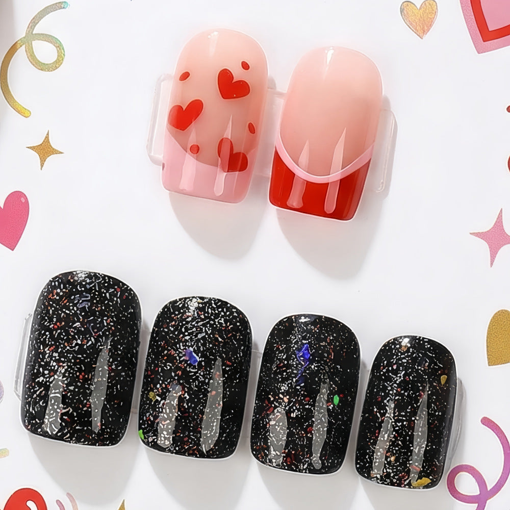 Creative artificial nails with heart design and glitter effects Stornfield