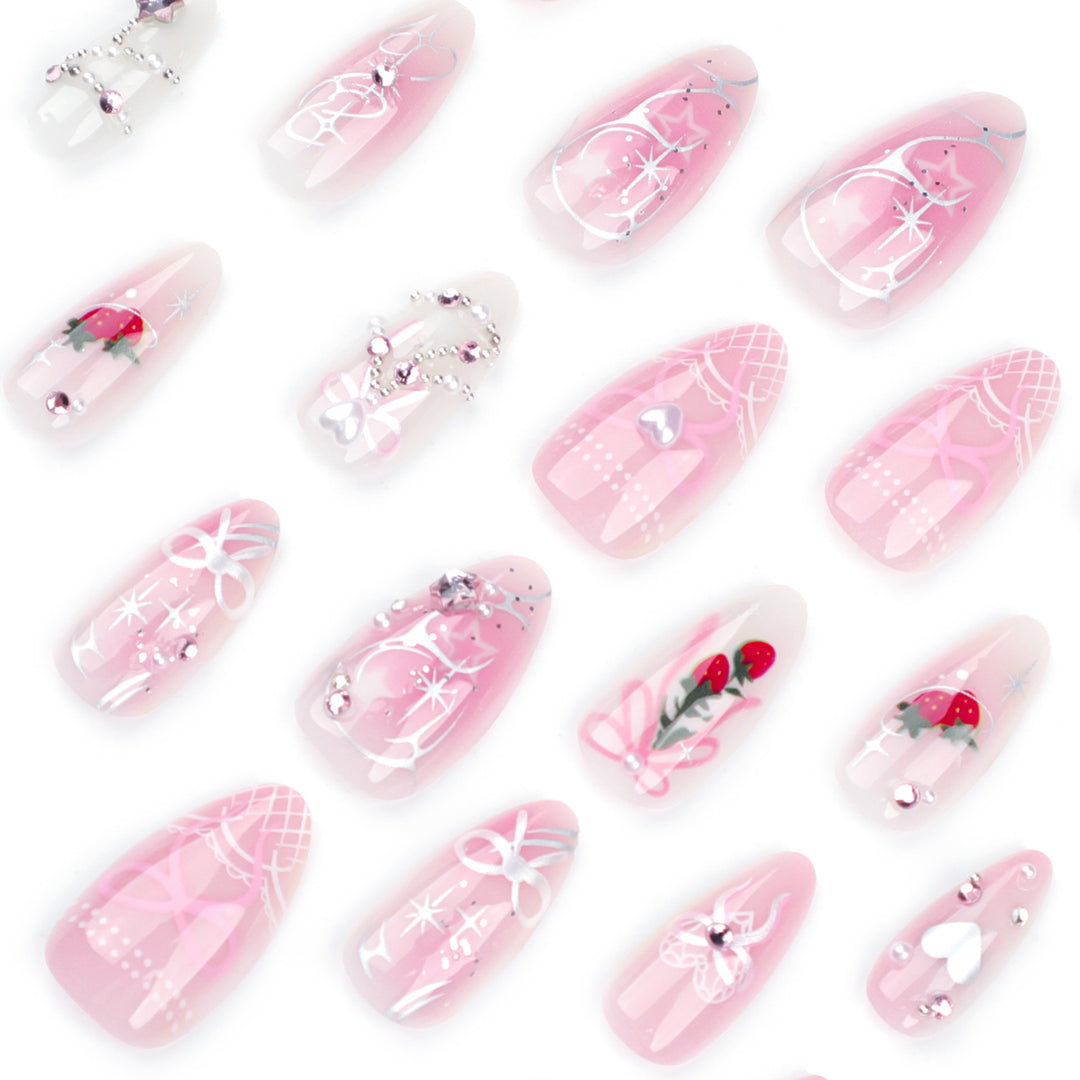 Artificial nail art with romantic design and glitter accents Stornfield