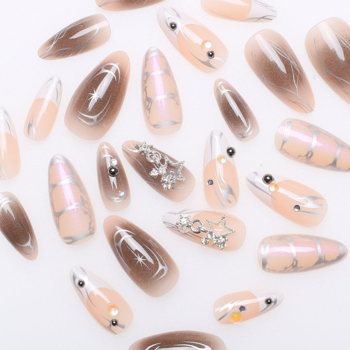 Artistic Stiletto Nail Extensions with Metallic Accents Stornfield