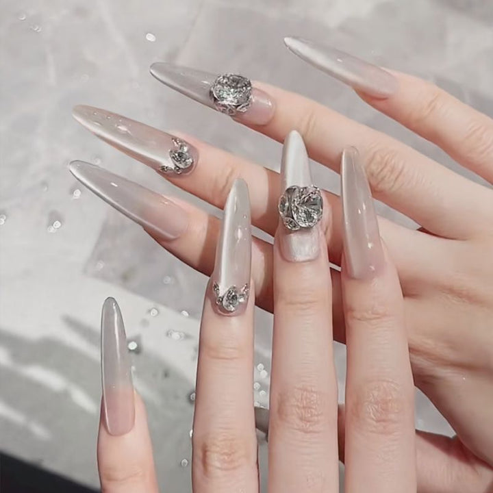 Acrylic nail set with elegant tips and glamorous rhinestone accents Stornfield