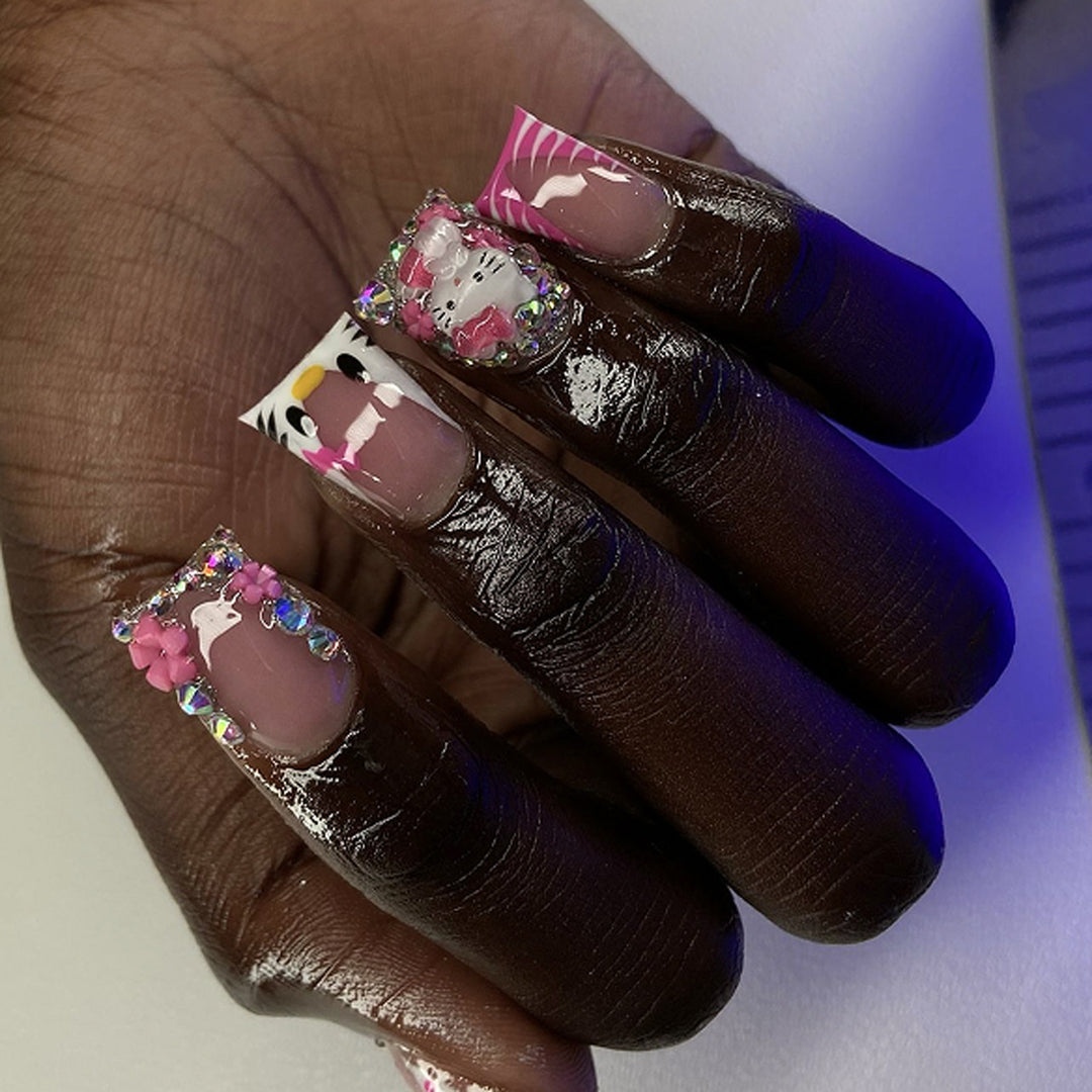 Artistic Nail Art with Animal Motifs and Glitter Accents Stornfield