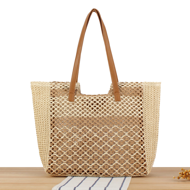 Shopping bag made of woven natural material with elegant leather handles Stornfield