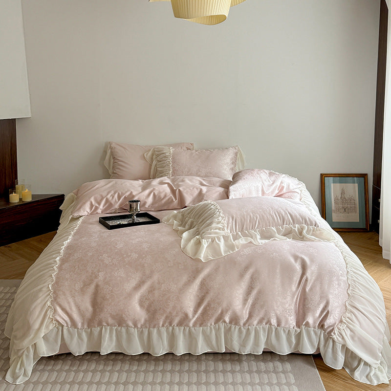 Satin bedding set with ruffled border and fine damask relief
