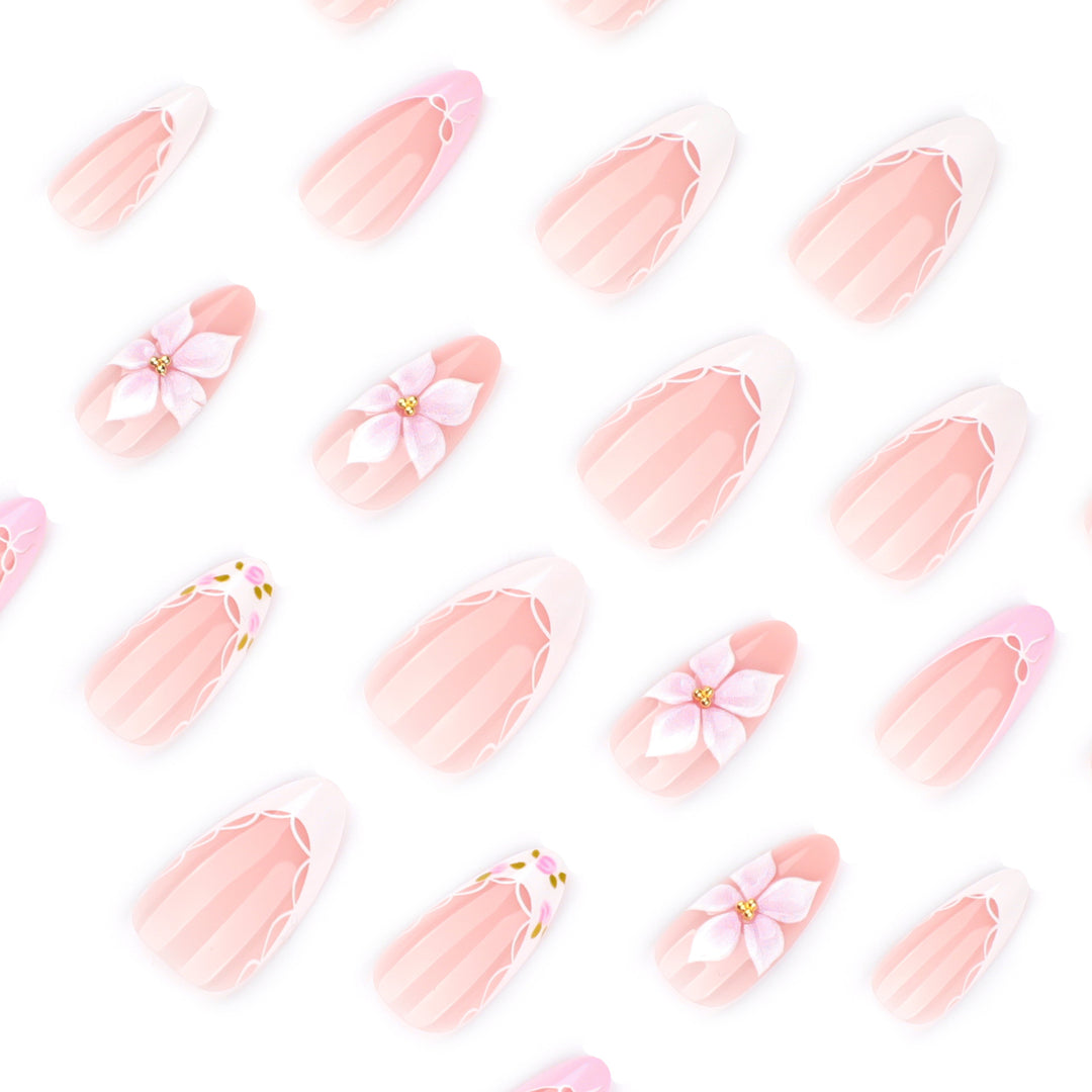 Artful nail extensions with delicate floral pattern and elegant accents Stornfield