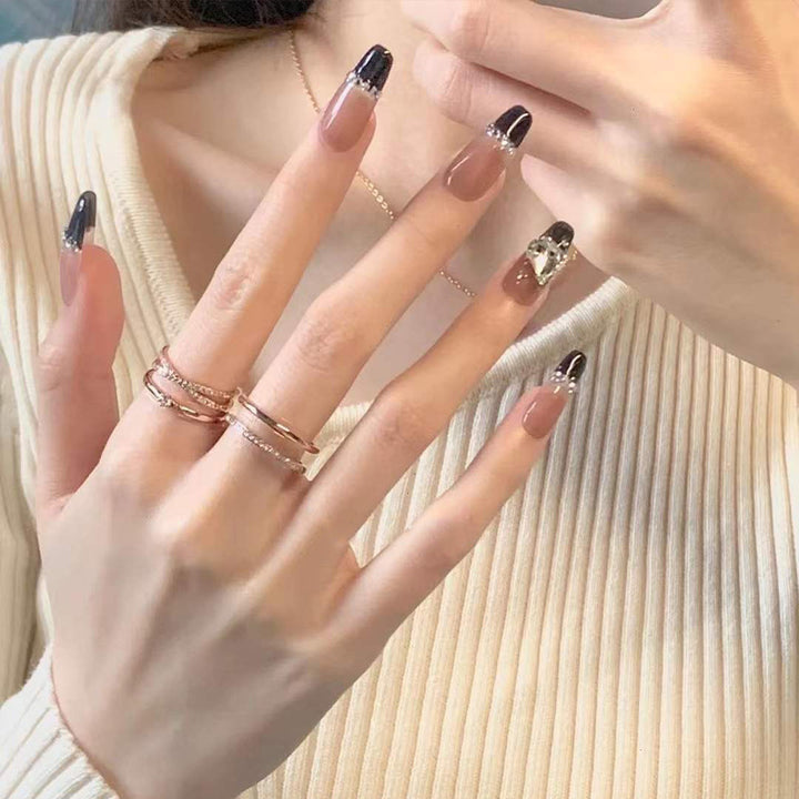 Stylish art false nails with heart design and glitter Stornfield