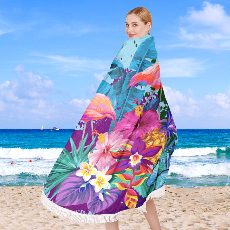 Round beach towel with tropical leaf print and fringe decoration Stornfield