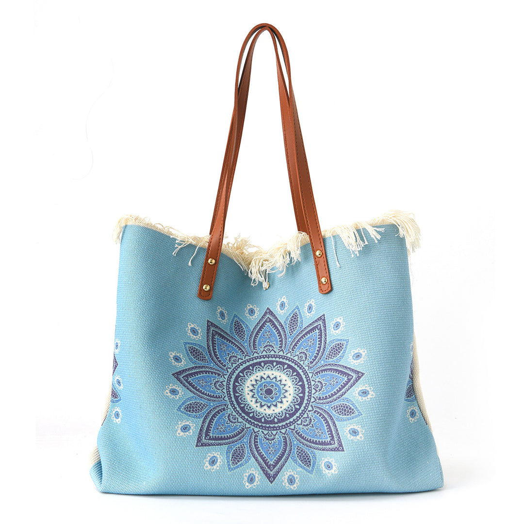 Beach bag with floral pattern and fringes Stornfield