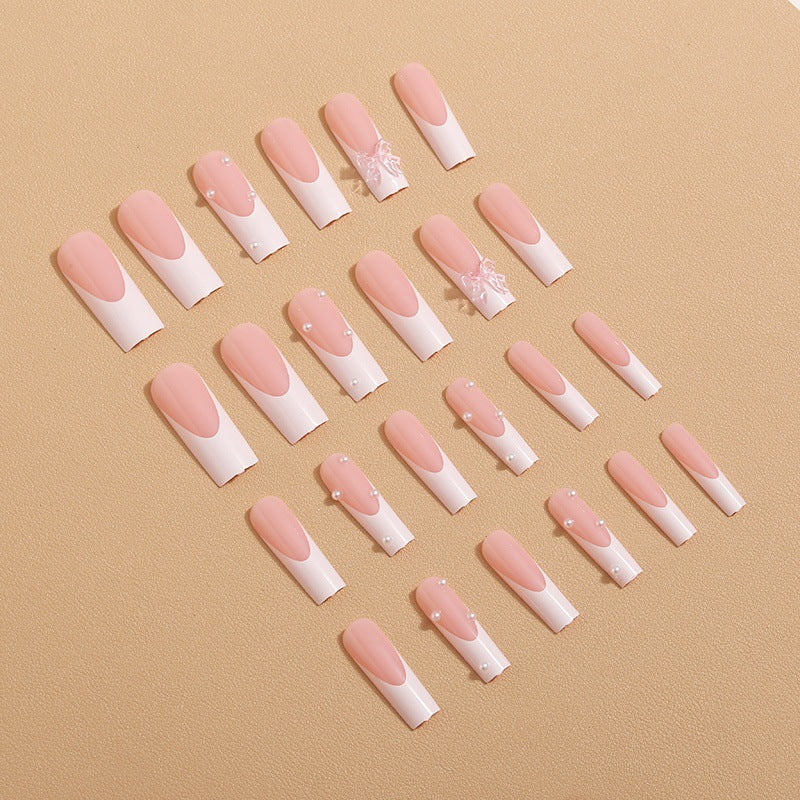 Artistic nail extensions with pearls and bows decorations Stornfield