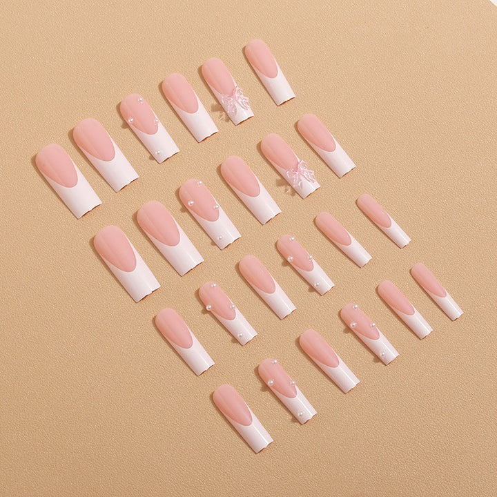 Artistic nail extensions with pearls and bows decorations Stornfield