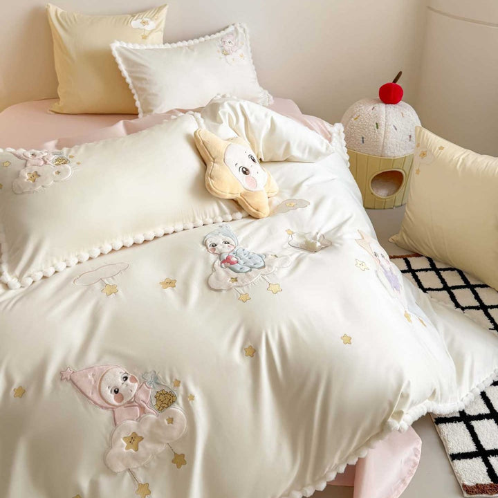 Bedding set for children with stitched cloud and star appliqués