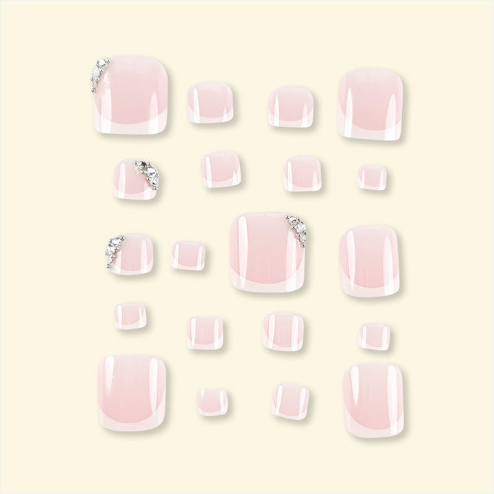 Artificial nail set with elegant French manicure and glitter accents Stornfield