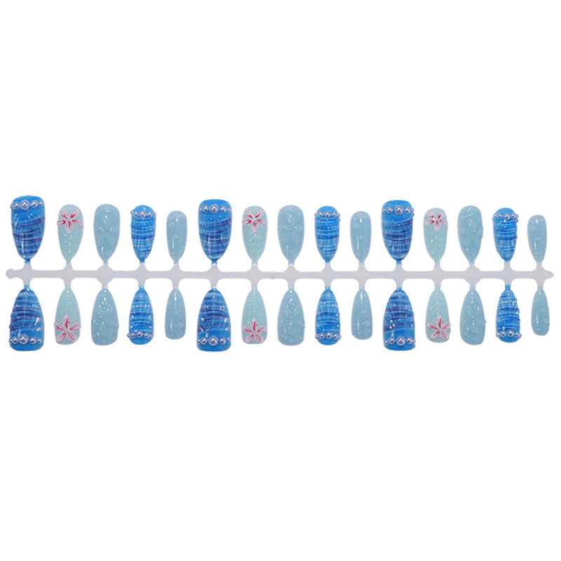 Nail art set with unique aquatic motifs and decorative accents Stornfield