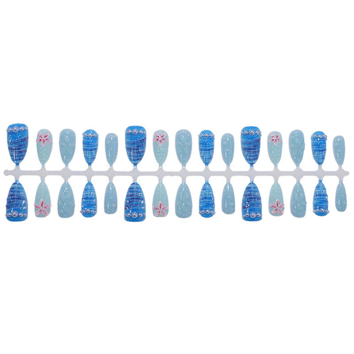 Nail art set with unique aquatic motifs and decorative accents Stornfield