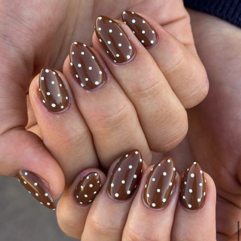Artificial nail art with playful dots and bows Stornfield