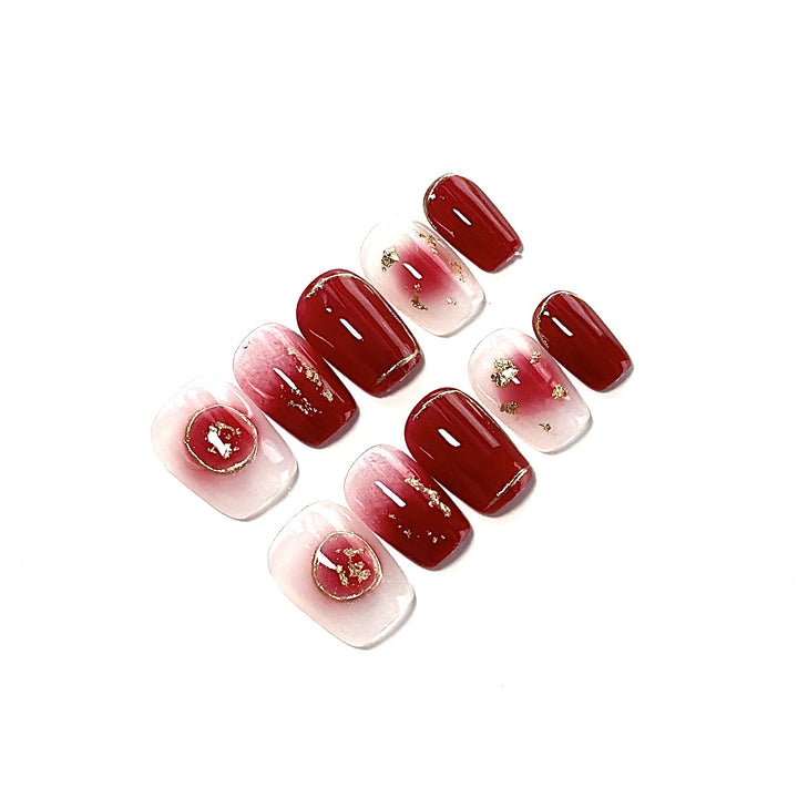 Artistic Press-On Nail Set with Floral and Golden Accents