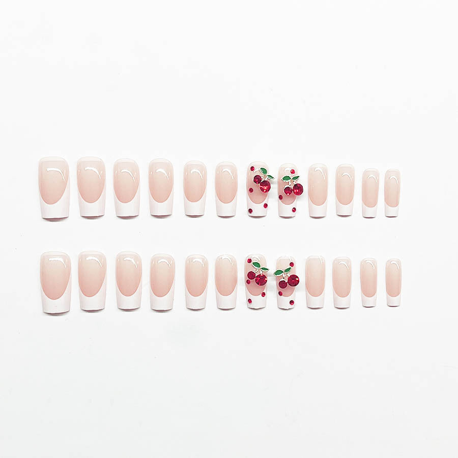 Acrylic nail set with chic cherry motifs and elegant French tip Stornfield