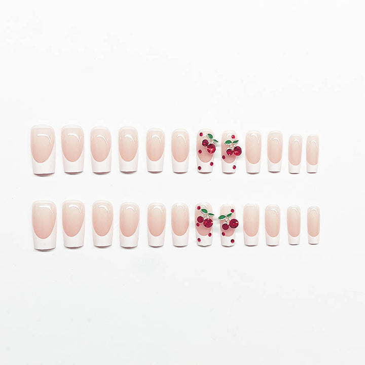 Acrylic nail set with chic cherry motifs and elegant French tip Stornfield