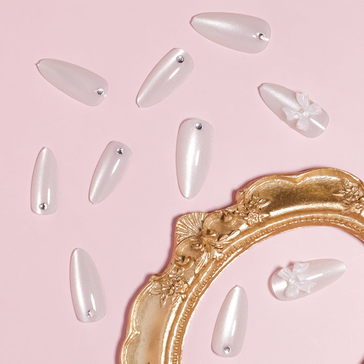 Elegant Stiletto-Shaped Press-On Nails with Decorative Bow Accents Stornfield