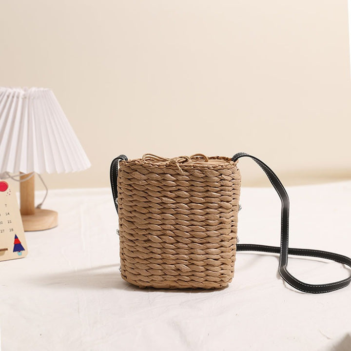 Bag made of woven natural material with sparkling appliqués Stornfield