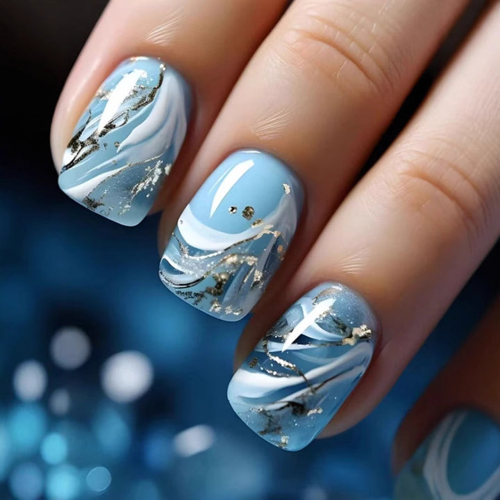 Acrylic nail set with luxurious marble design and gold accents Stornfield