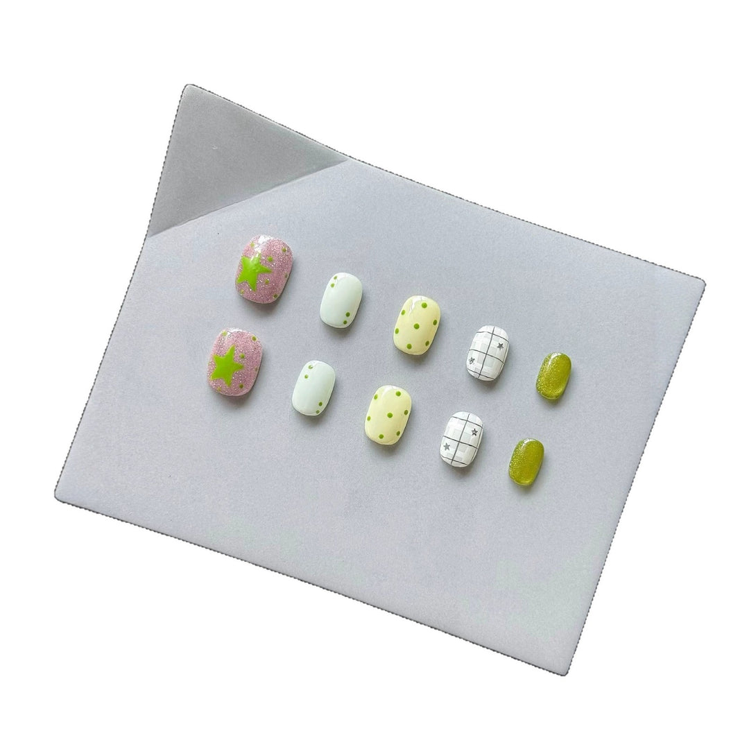Playful Press-On Nail Art Set with Fun Patterns and Glitter Accents