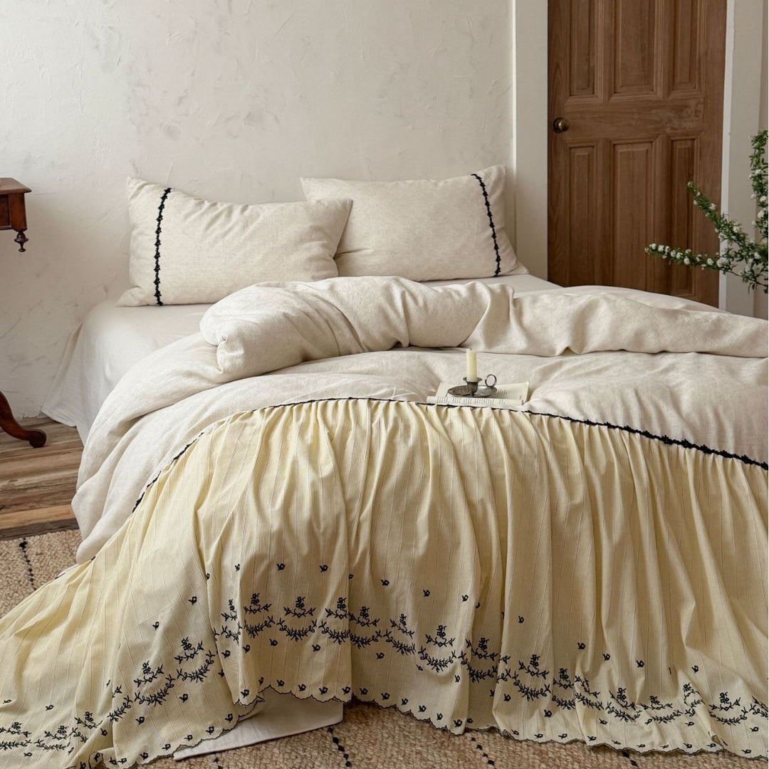 Bedding set with gathered bed skirt, embroidered trim and cotton-linen mix