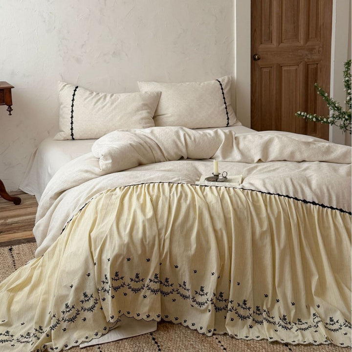 Bedding set with gathered bed skirt, embroidered trim and cotton-linen mix
