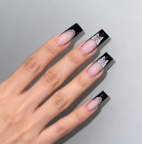 Glamorous artificial nails with detailed decorations Stornfield