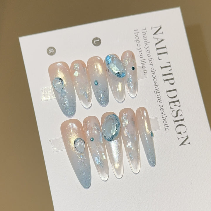 Artificial nails with rhinestones and glitter effects Stornfield