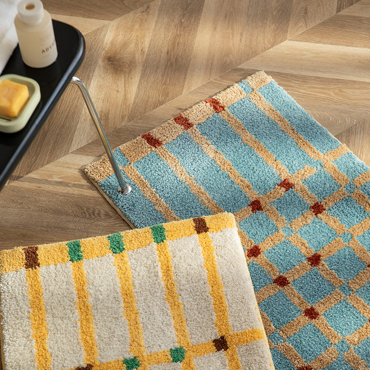 Soft runner bath mat with geometric checkered pattern and non-slip underside Stornfield