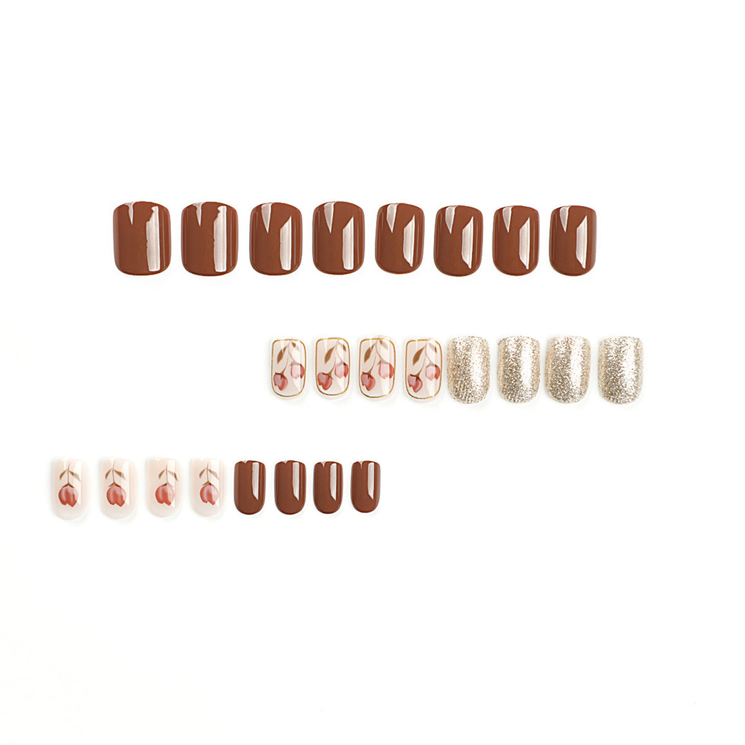 Artificial nail art with colorful flower design and glitter accents Stornfield