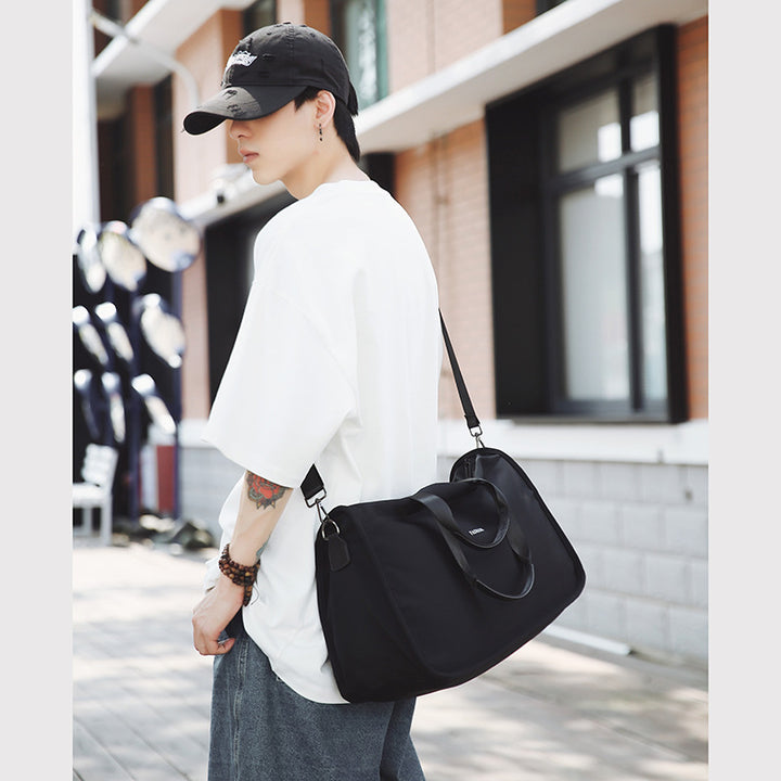 Sporty travel bag with ergonomic carrying handles and versatile compartments Stornfield