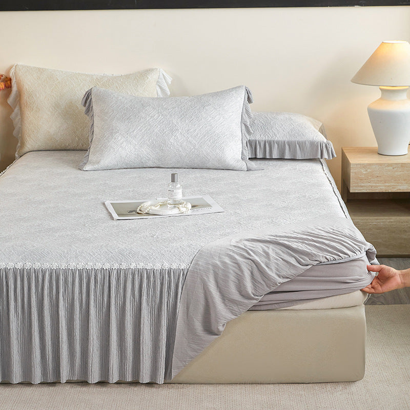 Reversible mattress protector with pleated ruffle and microfiber velvet surface