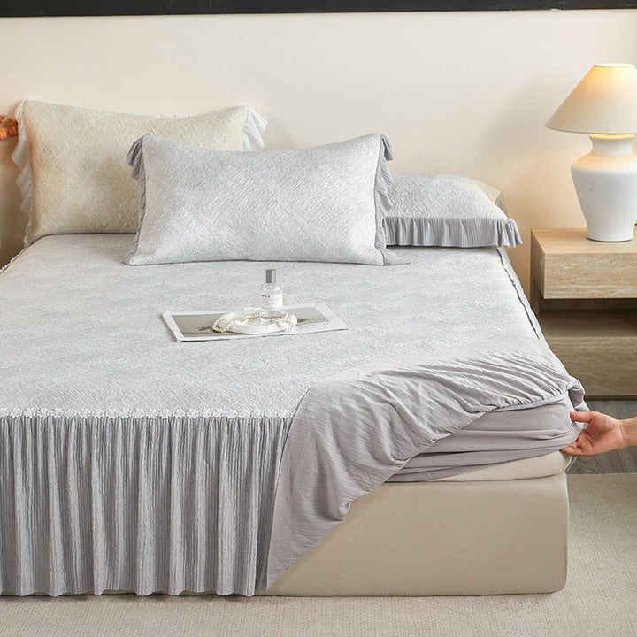 Reversible mattress protector with pleated ruffle and microfiber velvet surface