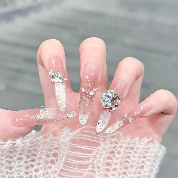 Artificial nails with glitter and crystal embellishments Stornfield