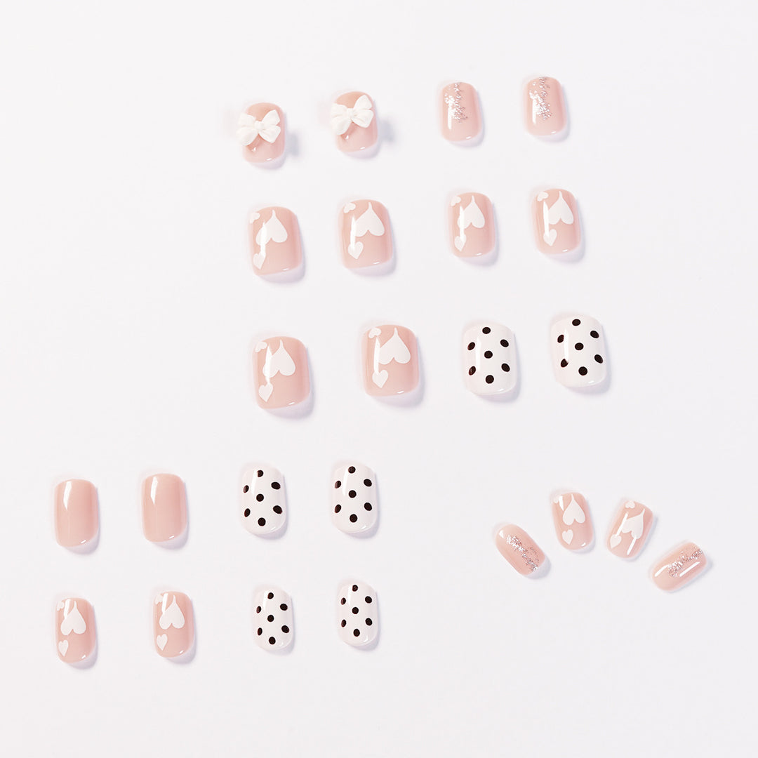 Artful nail art with delicate flower and heart motifs Stornfield
