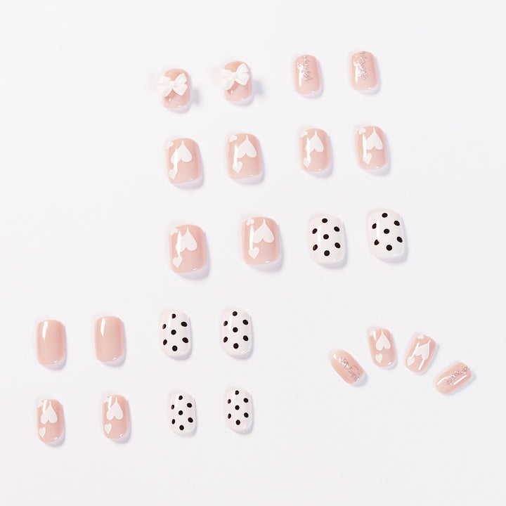 Artful nail art with delicate flower and heart motifs Stornfield
