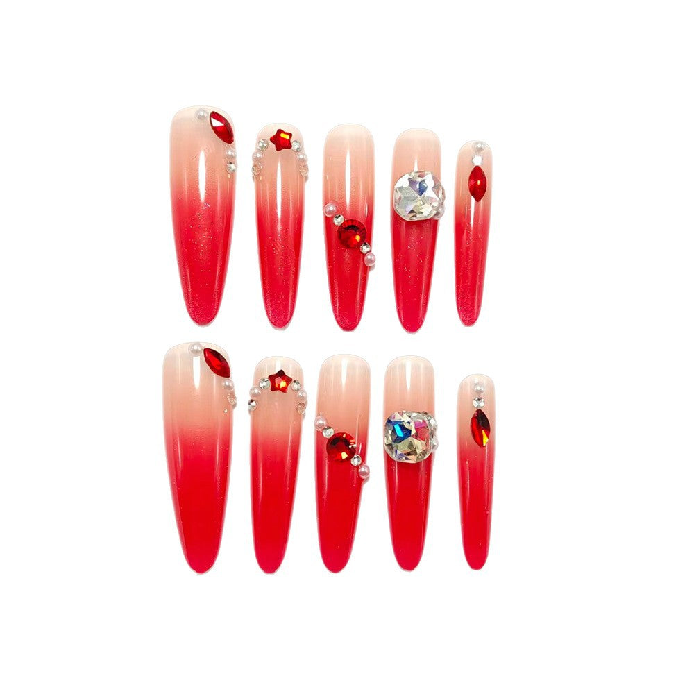 Artificial nails in elegant ombre style with glitter and jewelry accents Stornfield