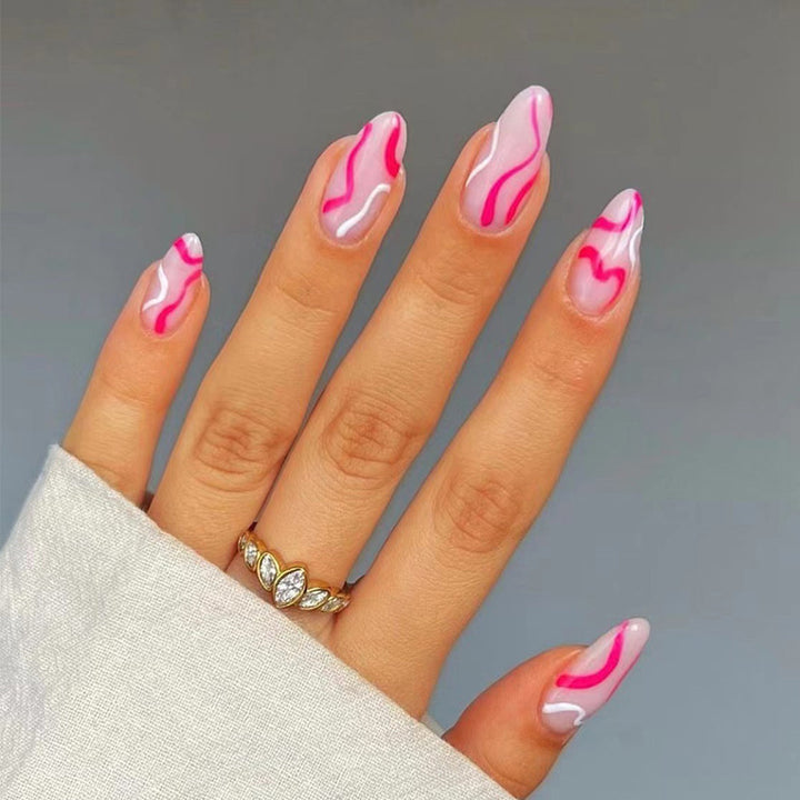Artful nail extensions with an elegant leaf pattern Stornfield