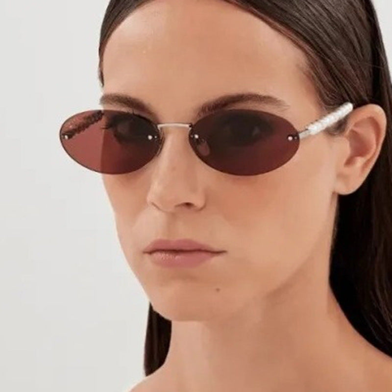 Women's stylish oval sunglasses with elegant embellishments Stornfield