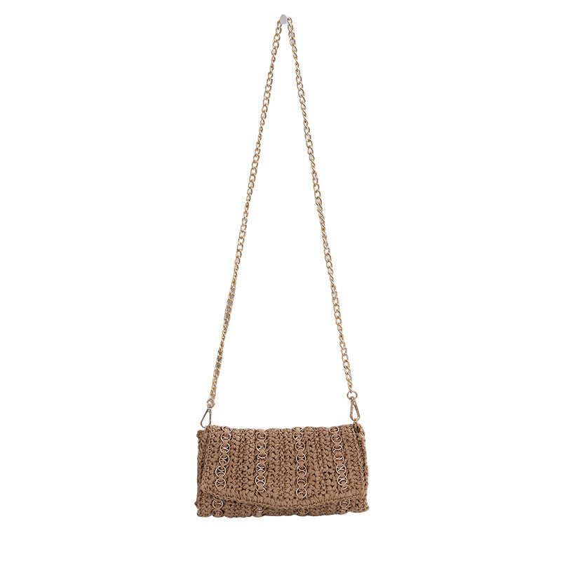 Clutch with chain shoulder strap and handcrafted macrame closure Stornfield
